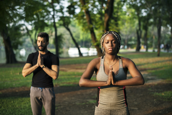 people yoga in a park 2022 12 15 23 05 35 utc
